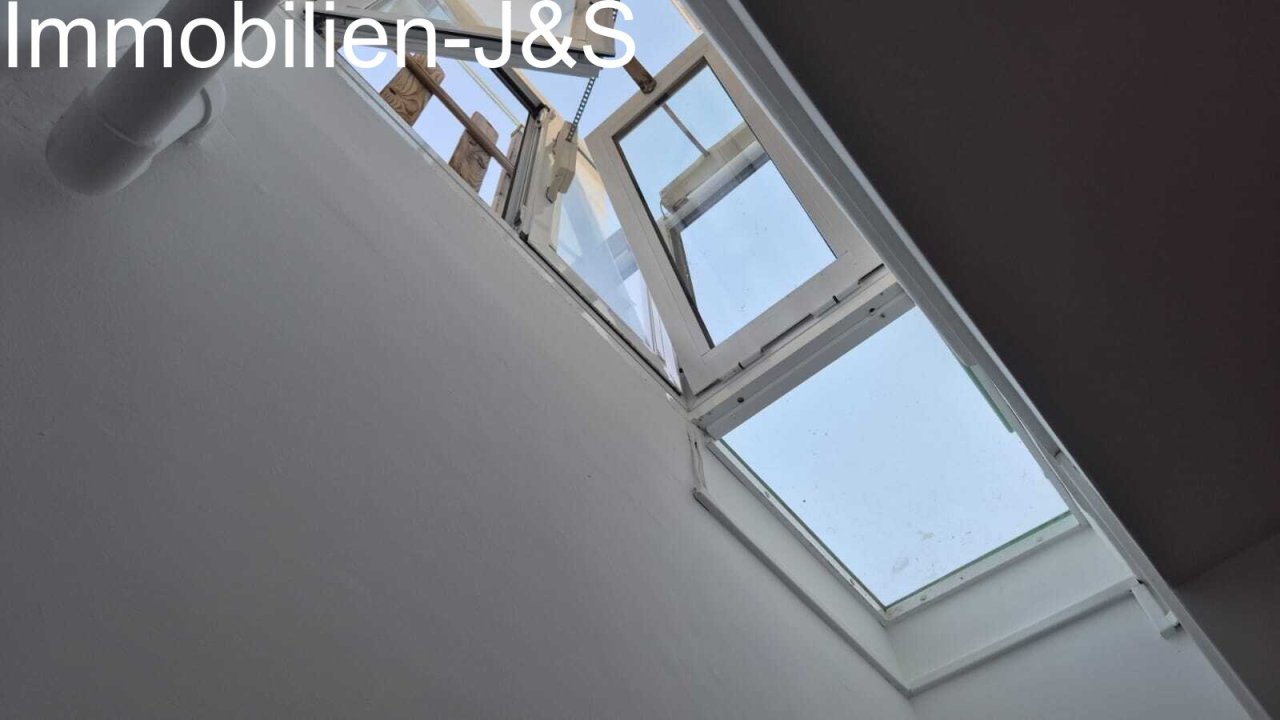 View into the ventilated light well for natural daylight in the basement