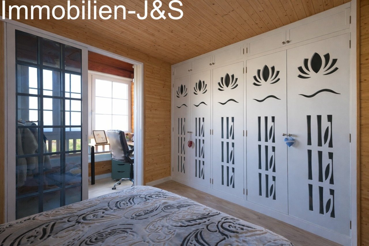 Built-in wardrobes with decorative cut-outs for natural air circulation.