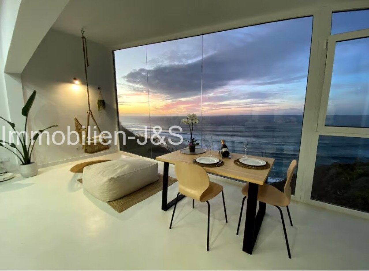 Open living / dining / kitchen area in the evening