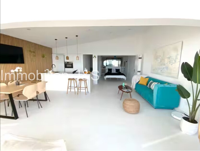 Open living / dining / kitchen area, rear view